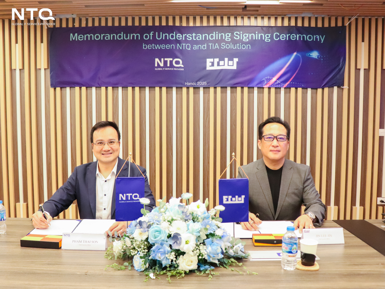 NTQ & TIA Solution's representative at the signing table 