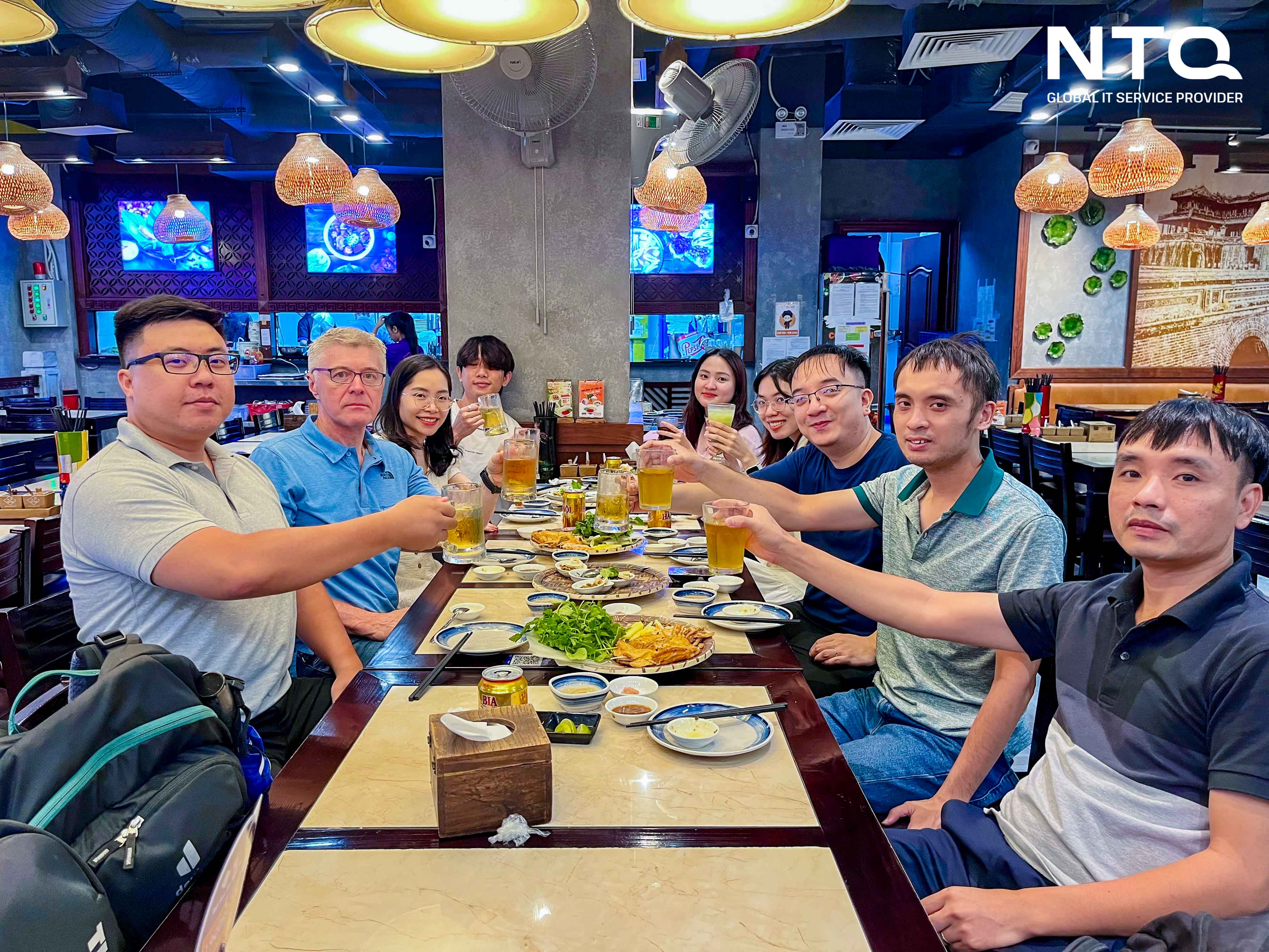 The effective collaboration & active communication have turned both companies into a unified team (Image: A bonding occasion between uHey and NTQ's team)